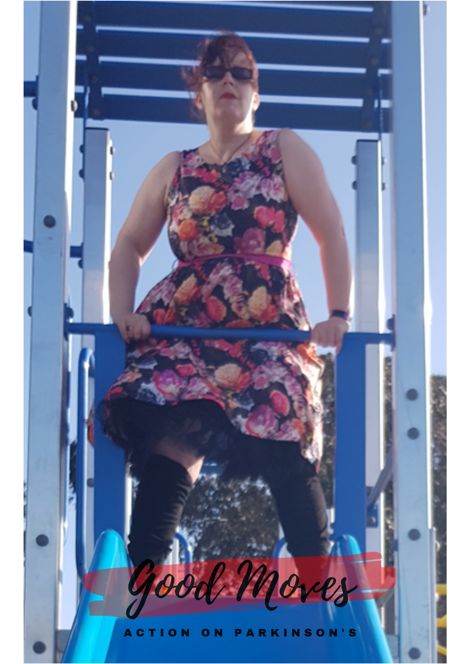 woman stood in commanding pose against a blue sky.